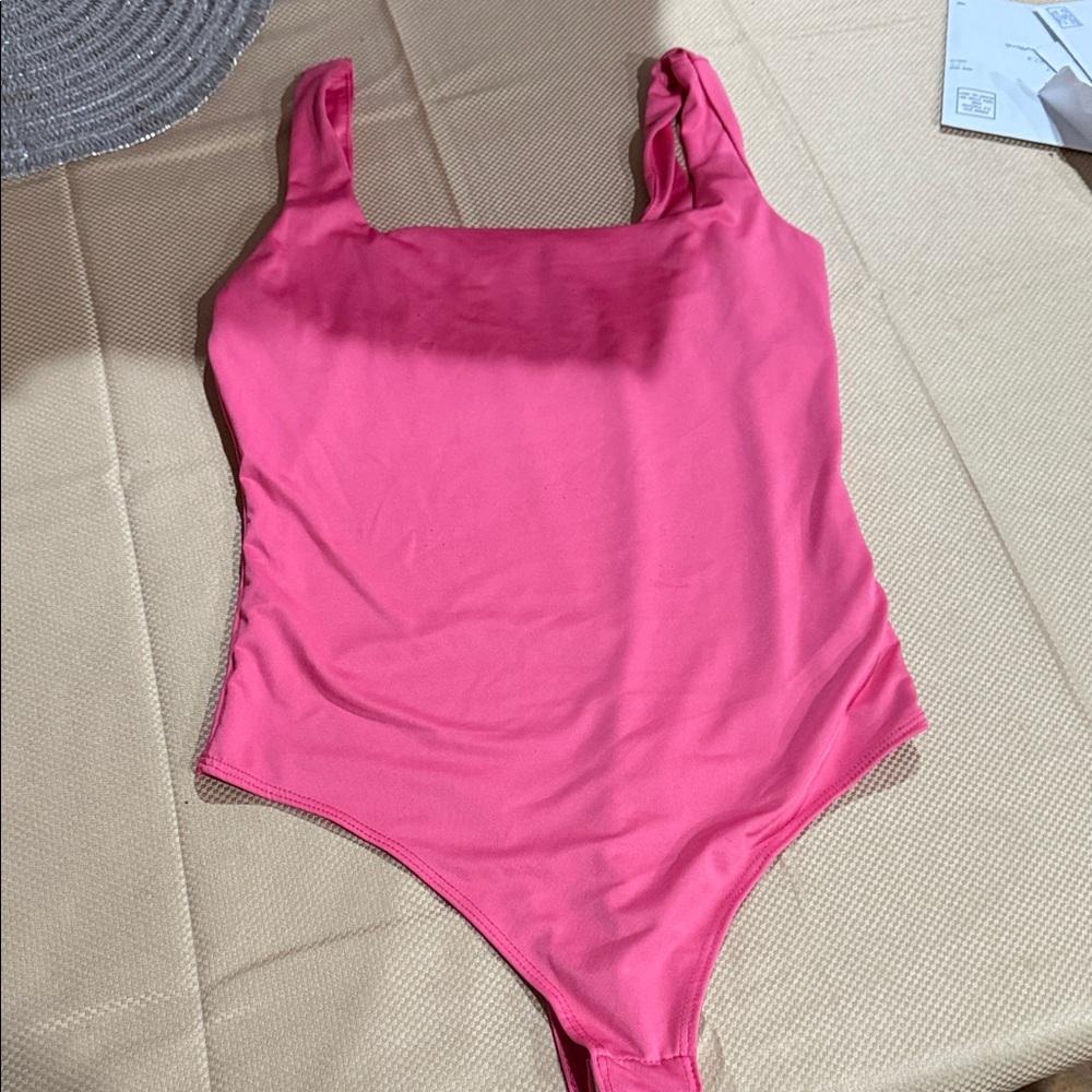 Pink bodysuit size medium